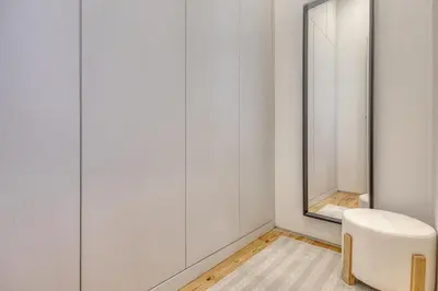 a dressing room with white walls and a mirror at OPORTO GUEST Downtown Escape in Porto