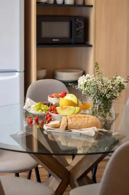 a glass table with a plate of food on it at Santa Catarina Haven by LovelyStay in Porto