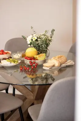 a glass table with a bunch of food on it at Santa Catarina Haven by LovelyStay in Porto