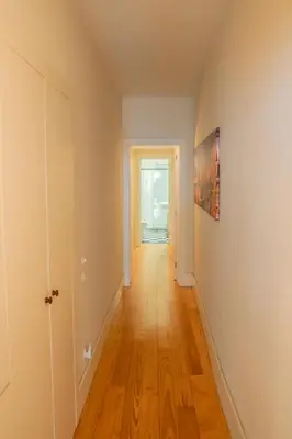 an empty hallway with a door and a painting on the wall at Porto Breeze in Porto