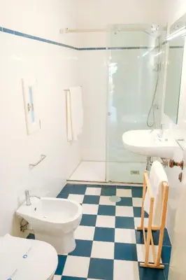 a bathroom with a sink and a toilet and a shower at Porto Breeze in Porto