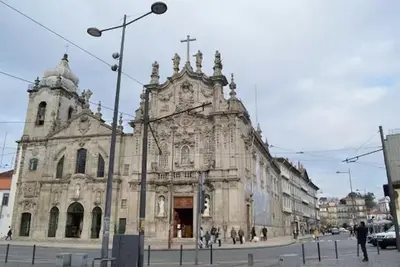 an old church with a cross on the front of it at Open-Air Terrace Studio in Historic Heart of Porto in Porto
