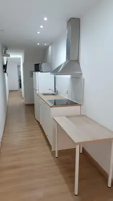 a kitchen with a sink and a bench in it at Open-Air Terrace Studio in Historic Heart of Porto in Porto