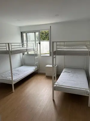 a room with three bunk beds and a window at Happy House - Império in Porto