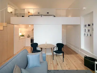 a living room with a couch and a table at FLH Porto Modern Flat in Porto
