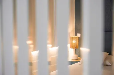 a lamp sitting on a table in a room at GuestReady - The perfect urban retreat in Porto
