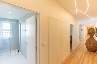 a hallway with a glass door and a vase at GuestReady - Urban retreat in Porto in Porto