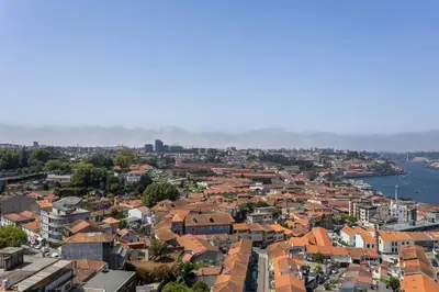 an aerial view of a city with buildings and water at Liiiving in Gaia - Douro Balcony View in Vila Nova de Gaia