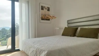a bedroom with a bed and a large window at RIVER VIEW TMB oporto station house in Porto