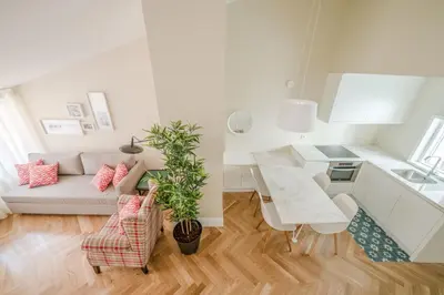 a white living room with a couch and a table at Mouzinho 160 in Porto