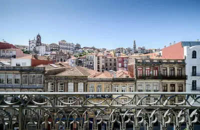 a view of a city from a bridge with buildings at Mouzinho 160 in Porto