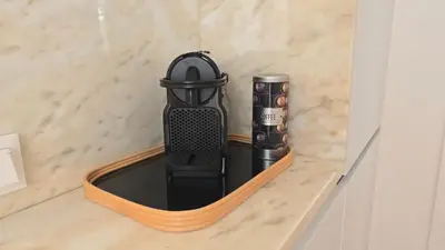 a wireless router sitting on a shelf in a room at Fontainhas Sunny Rooftop with balcony in Porto