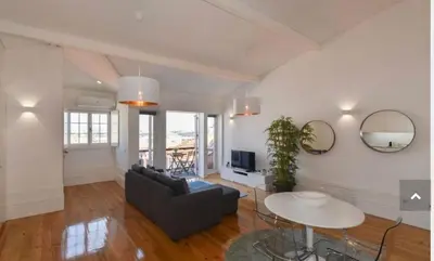a living room with a couch and a table at Top of the World by Upperground in Porto