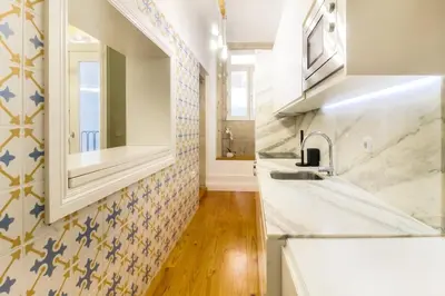 a kitchen with a sink and a mirror at Avantgarde by Upperground in Porto