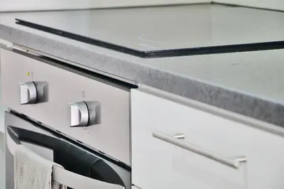 a white kitchen with a counter and a sink at KOPKE 113, local & spacious 2Bed in Porto