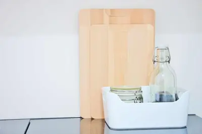 a bottle in a white container next to a book at KOPKE 113, local & spacious 2Bed in Porto