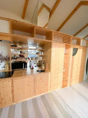a large kitchen with wooden cabinets in a room at Plunge Pool River Views Apt A Adults Only in Porto