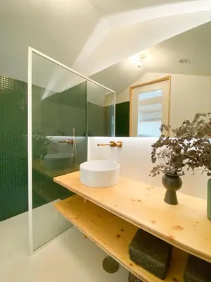 a bathroom with a sink and a glass shower at Plunge Pool River Views Apt A Adults Only in Porto
