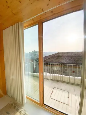 a large window with a view of a balcony at Plunge Pool River Views Apt A Adults Only in Porto