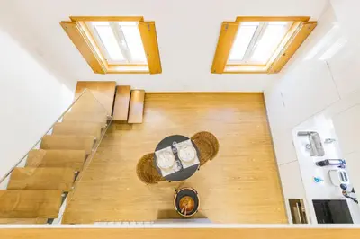 a living room with a couch and a table at Inner Center Porto in Porto