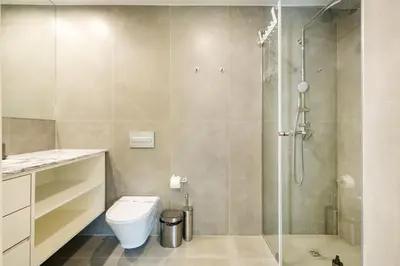 a bathroom with a toilet and a shower at GuestReady - Gracious City Escape in Porto in Porto