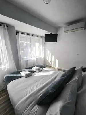 a bedroom with a large bed with pillows on it at Best Deal Porto Apartment - Porto Velho Apt in Porto