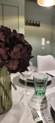 a blue bedroom with a bed and a vase of flowers at Best Deal Porto Apartment - Porto Velho Apt in Porto