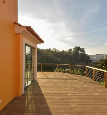 a wooden boardwalk leading to a balcony of a house at Quinta de Sá in Vila Nova de Gaia