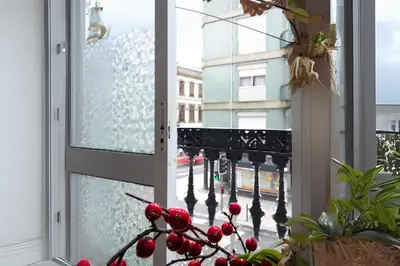 a window with a view of a balcony at Studios Faria Guimaraes in Porto