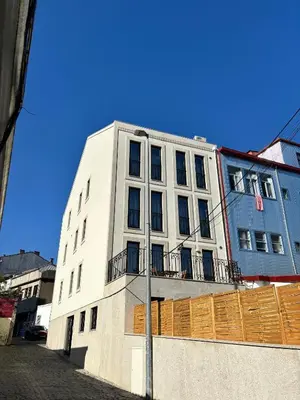 a tall white building with a fence in front of it at AC, 2Bedrooms APT, City Center 900m to Metro in Porto