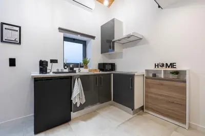 a kitchen with a sink and a counter top at Lapa 4 House in Porto
