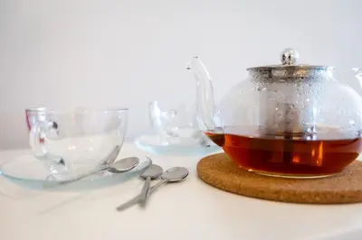 a tea pot and glasses on a table at Urban Oasis Six Suites Apts Porto in Porto