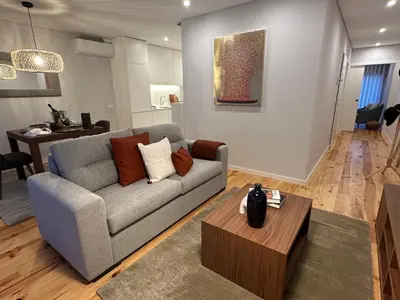 a living room with a couch and a table at Urban Oasis Six Suites Apts Porto in Porto