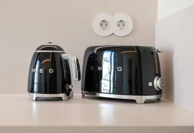 two black toasters sitting on top of a counter at Sa Bandeira Signature Apartment in Porto
