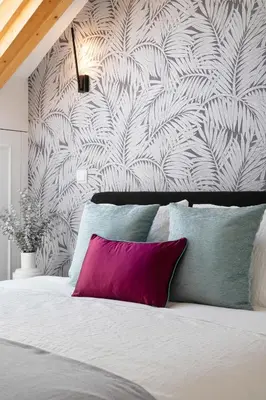 a bedroom with a bed with a pink pillow at 89 T3 - Flores Gem in Porto