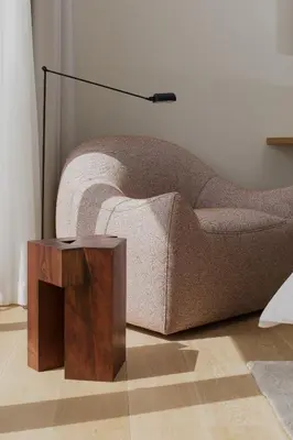 a living room with a couch and a wooden table at LENSCAPE Coterie in Porto