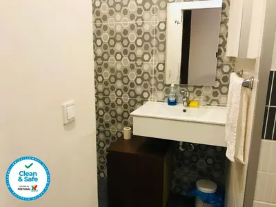 a bathroom with a sink and a mirror at In Love Bolhão in Porto