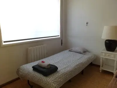 a bedroom with a bed with a stuffed animal on it at Quiet Studio City Center in Porto