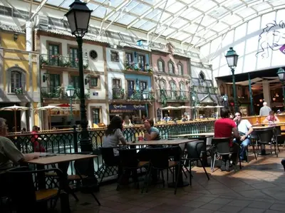 a group of people sitting at tables in a restaurant at Quiet Studio City Center in Porto