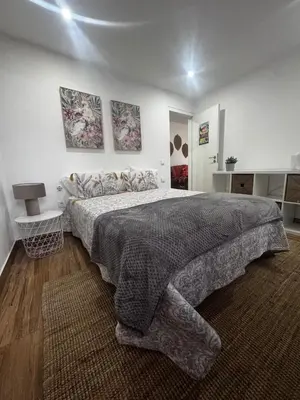 a bedroom with a large bed in a room at Simple House in the Heart of the Historic Center in Porto
