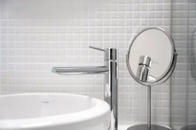 a bathroom with a sink and a mirror at GuestReady - Lovely nook with mezzanine in Porto