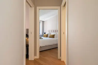 a bedroom with a bed and a large mirror at Oliveirinhas Boutique Flats in Porto