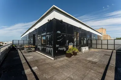 a black and white building on top of a roof at GuestReady – Urban comfort in Vila Nova de Gaia in Vila Nova de Gaia