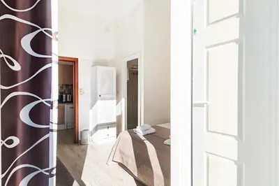 a room with a bed and a mirror at Cimo Apartments - Center Porto in Porto