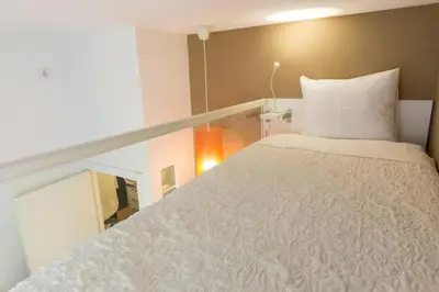 a large white bed in a small room at Downtown Porto Twins II - City Center in Porto