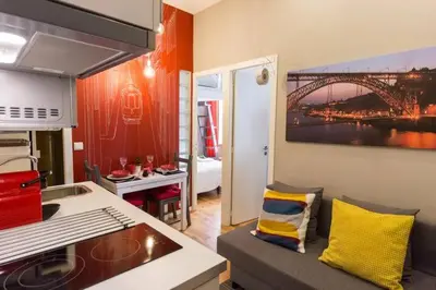a room with a kitchen with a view of a bridge at Downtown Porto Twins II - City Center in Porto