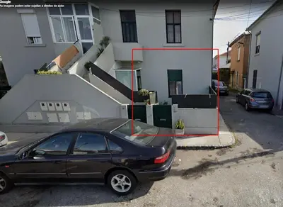 a black car parked in front of a house at Apartment near Porto University Campus T2 in Porto