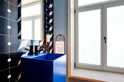 a blue room with a mirror and a blue table at Porto Heritage Balcony Apartment in Porto