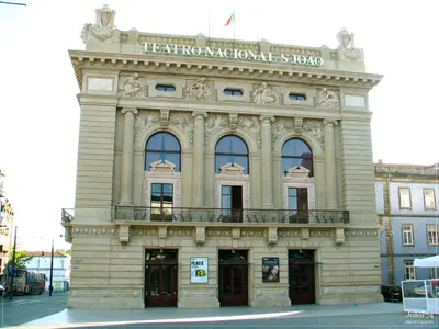 a building with a sign on top of it at Studios Baixa Downtown Porto in Porto