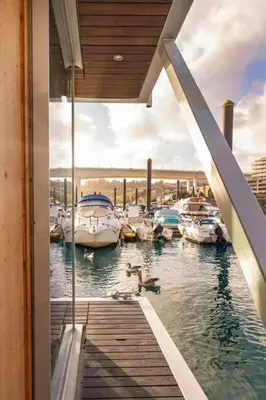 a view of a marina with boats in the water at SLEEPBOAT- Modern Houseboat in Porto in Bicas